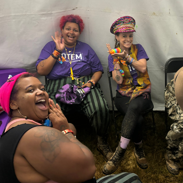 TOTEM board members and fans are at the TOTEM Booth at the South Star Music Festival in Huntsville, Alabama. TOTEM is a non-profit that supports underserved individuals at music festivals. 